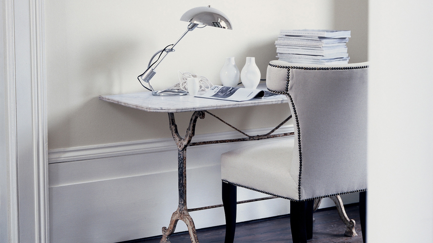 A study decorated in sophisticated shades of white and off-white.
