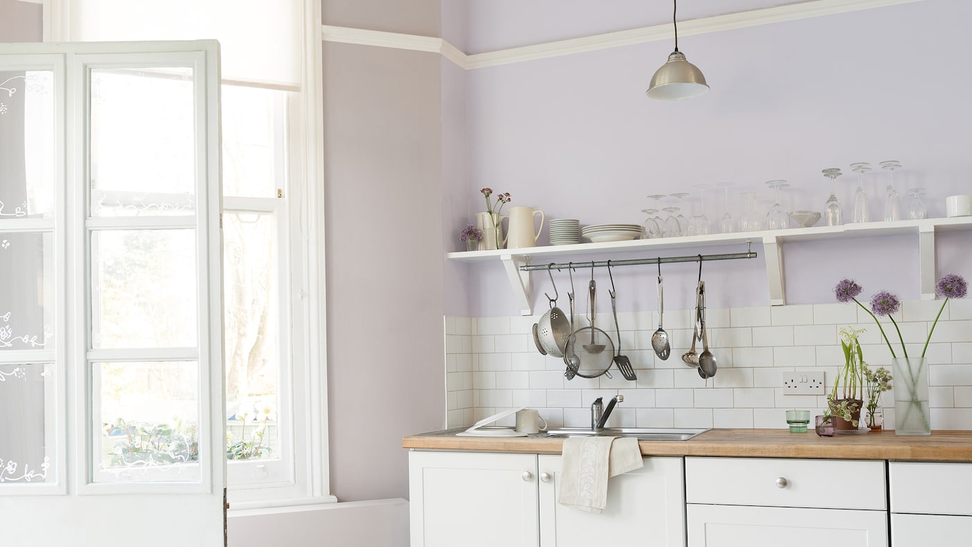 Combine soft chalky colours and natural materials for a rustic French kitchen look.