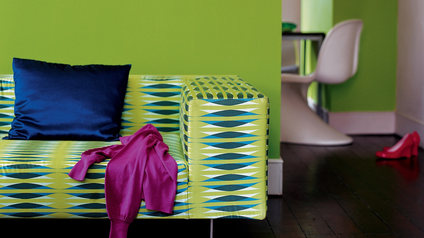 Living room decorated in lively shades of lime, electric blue and fuchsia.
