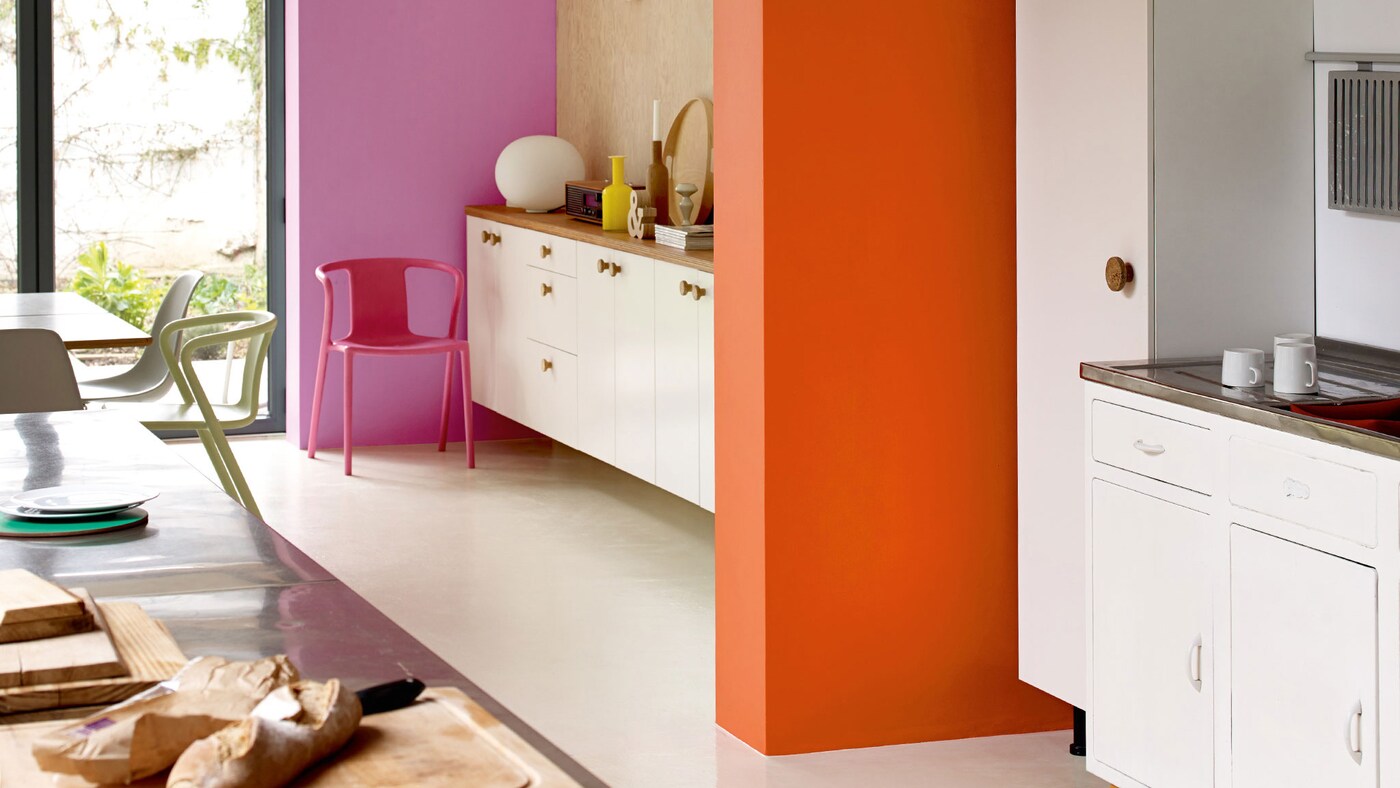 Decorating an open-plan kitchen? Use a contrasting colour scheme to create a welcoming space.