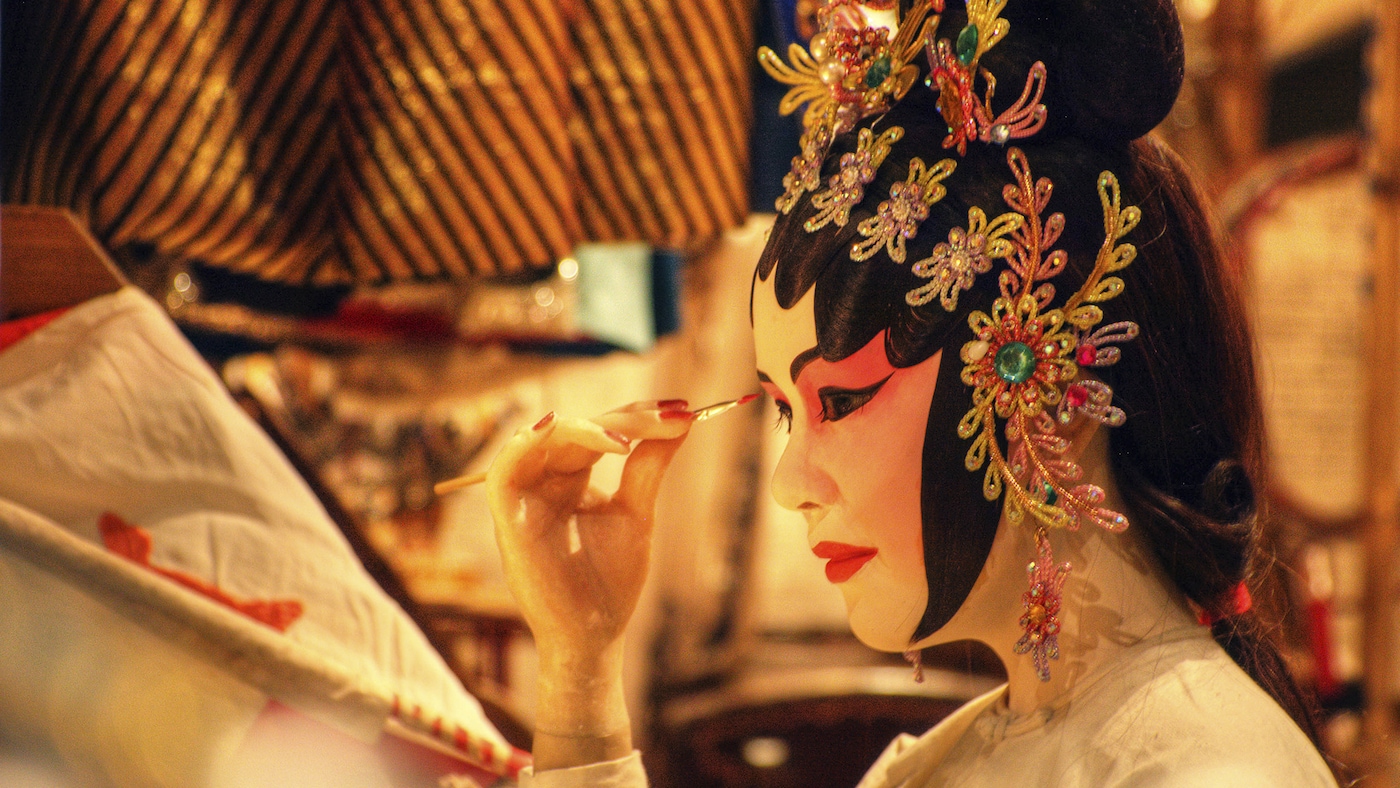 Chinese woman wears yellow as a symbol of progress and prosperity.