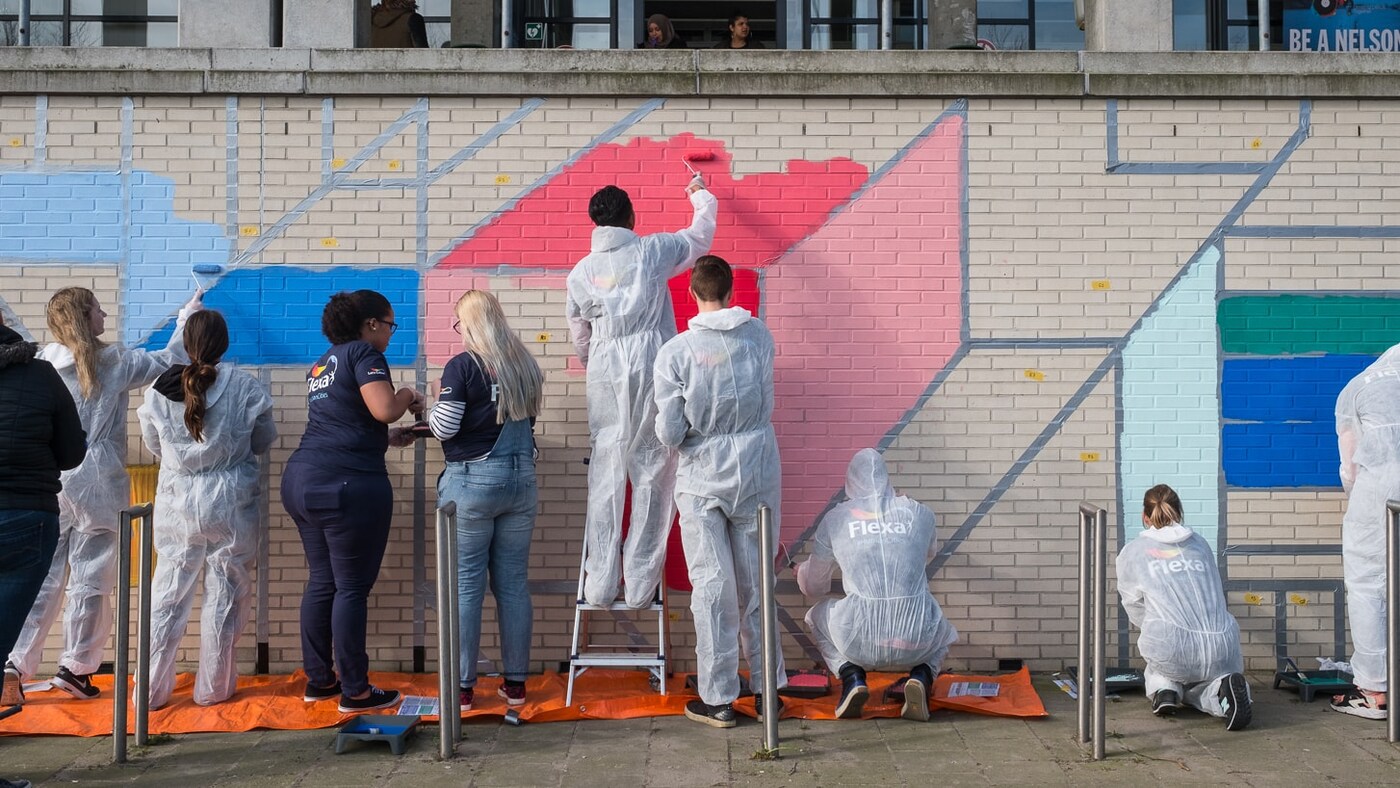people painting the wall