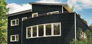 Vijf kleurrijke manieren om je gevelbetimmering te beschermen