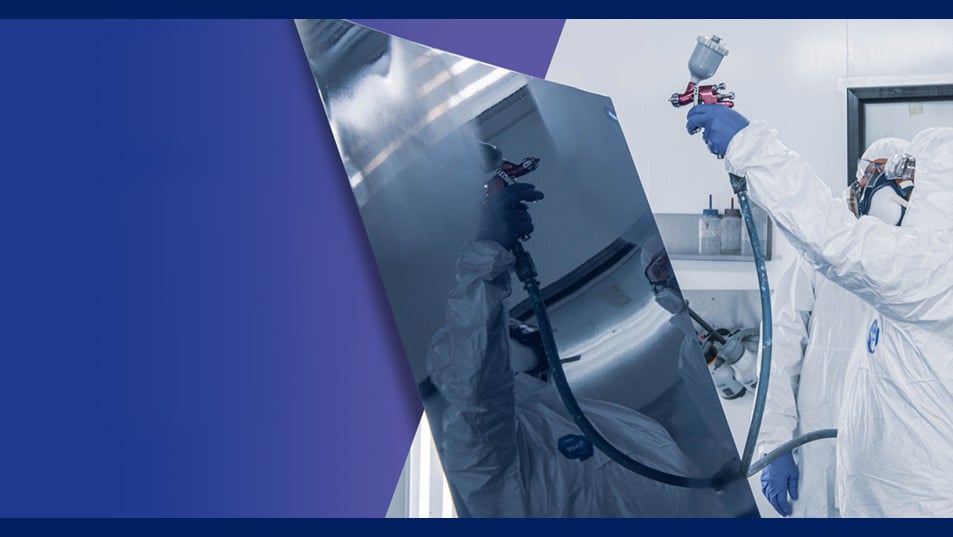 Painters spraying out a test panel in training.