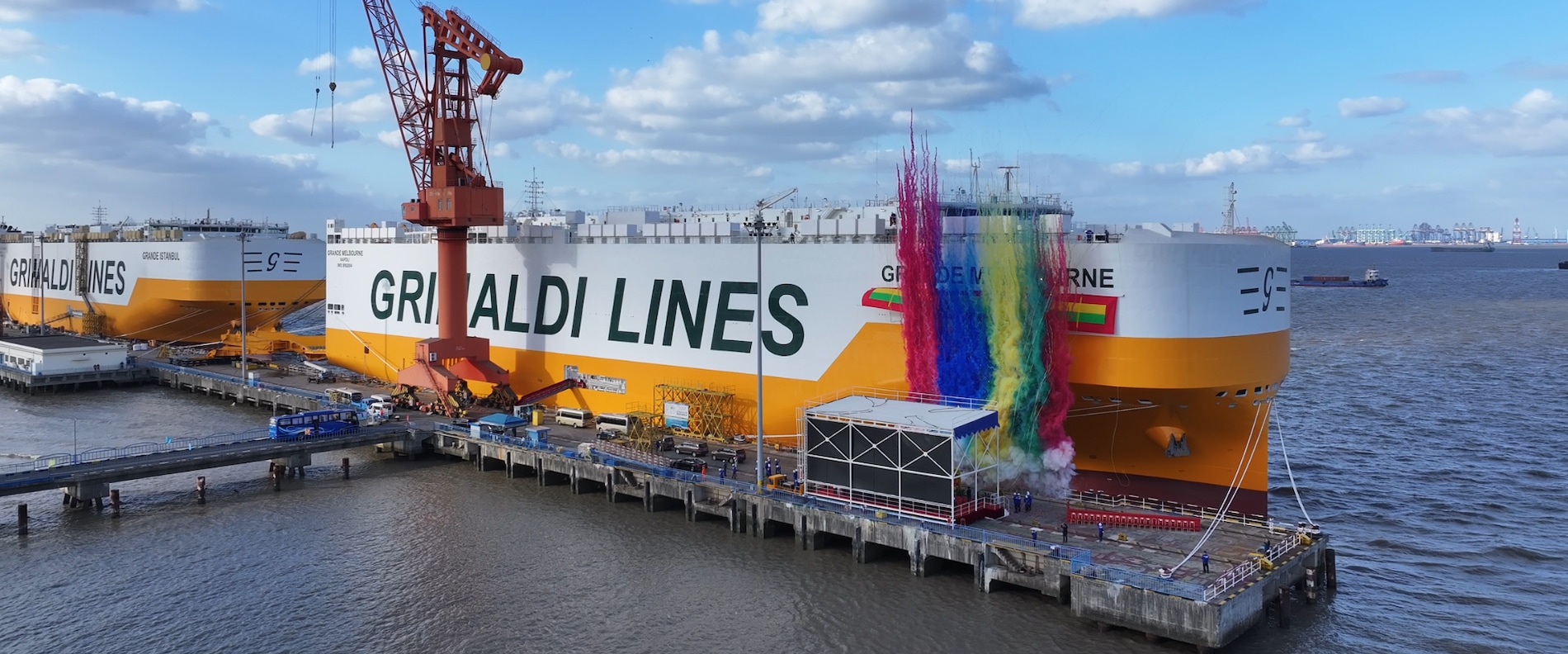 The Grande Melbourne Pure Car and Truck Carrier sailing at sea, with the Grimaldi Lines livery visible on the side.