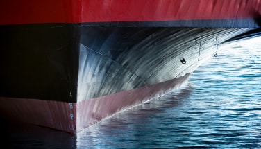 Ship hull at the waterline showing coated underwater surface in use