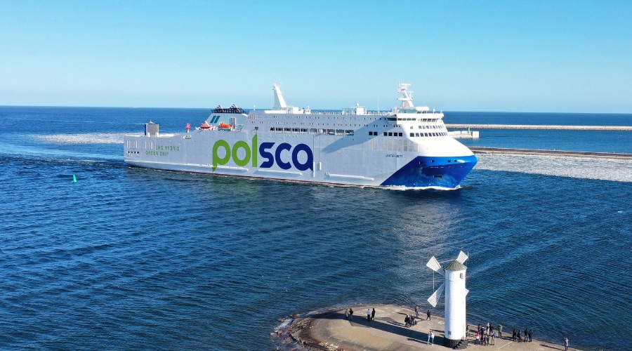 Jantar Unity passenger ferry sailing at sea near a harbour entrance