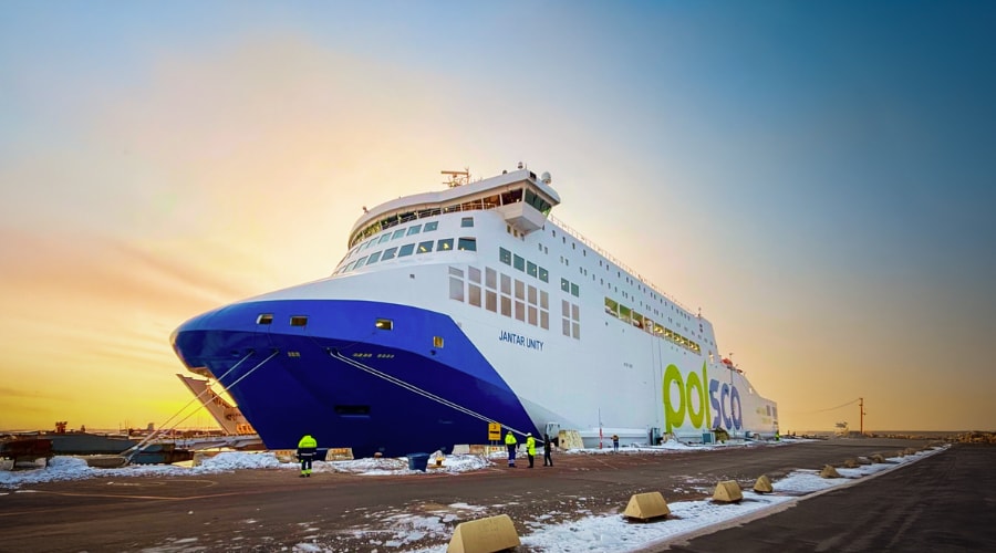 Jantar Unity passenger ferry docked at port with workers nearby