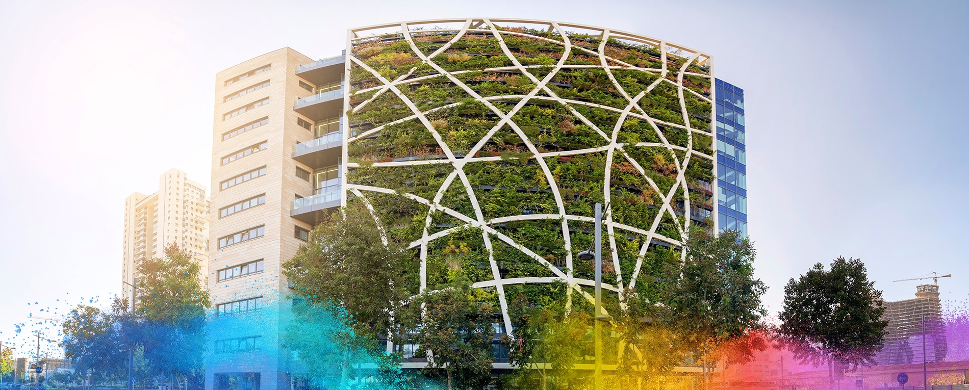 Modern building facade with plants supported by a white geometric structure