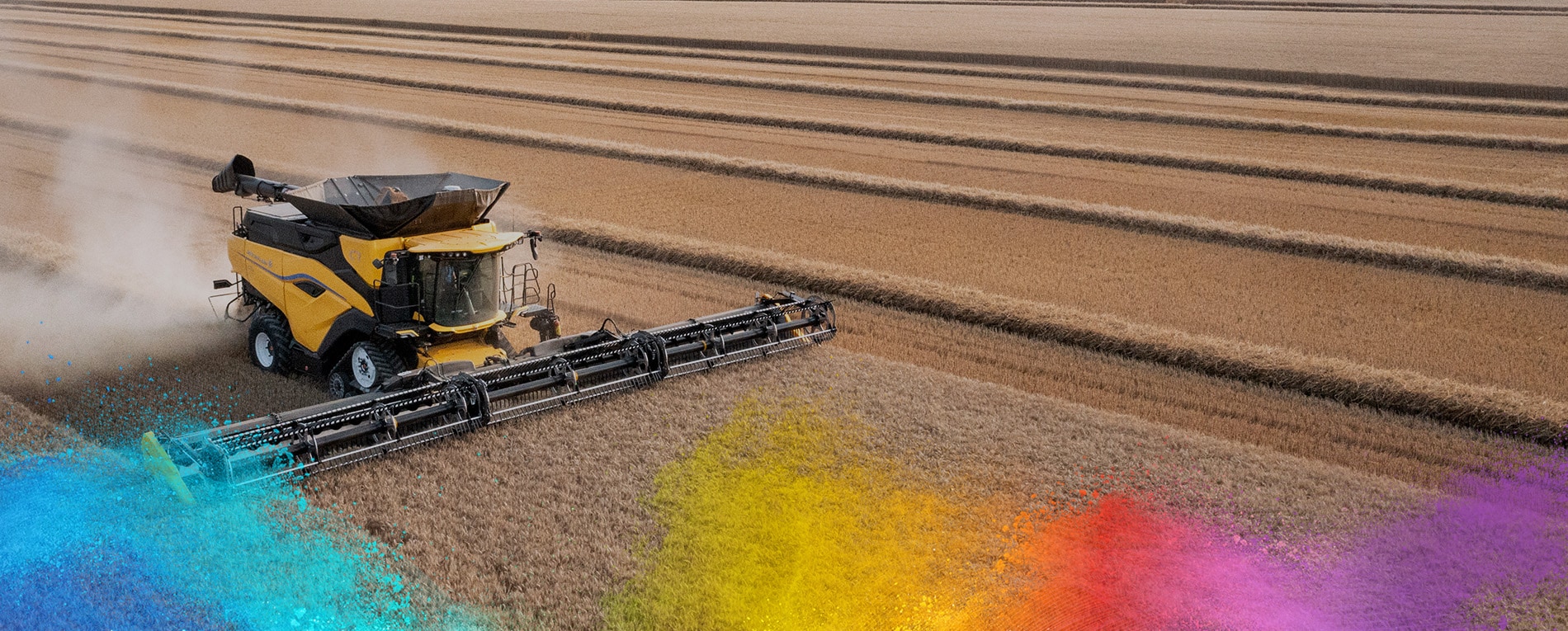 Yellow combine harvester working in a vast wheat field
