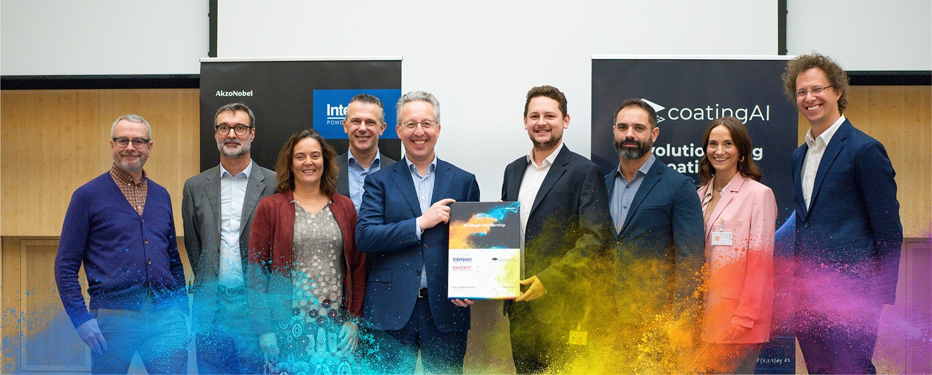 Group photo of AkzoNobel and coatingAI partners signing a launch agreement