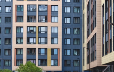 Building facade with golden powder-coated sections and windows