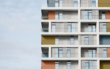Building facade with golden powder-coated balconies