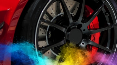 Close-up of red brake caliper coated with powder coating