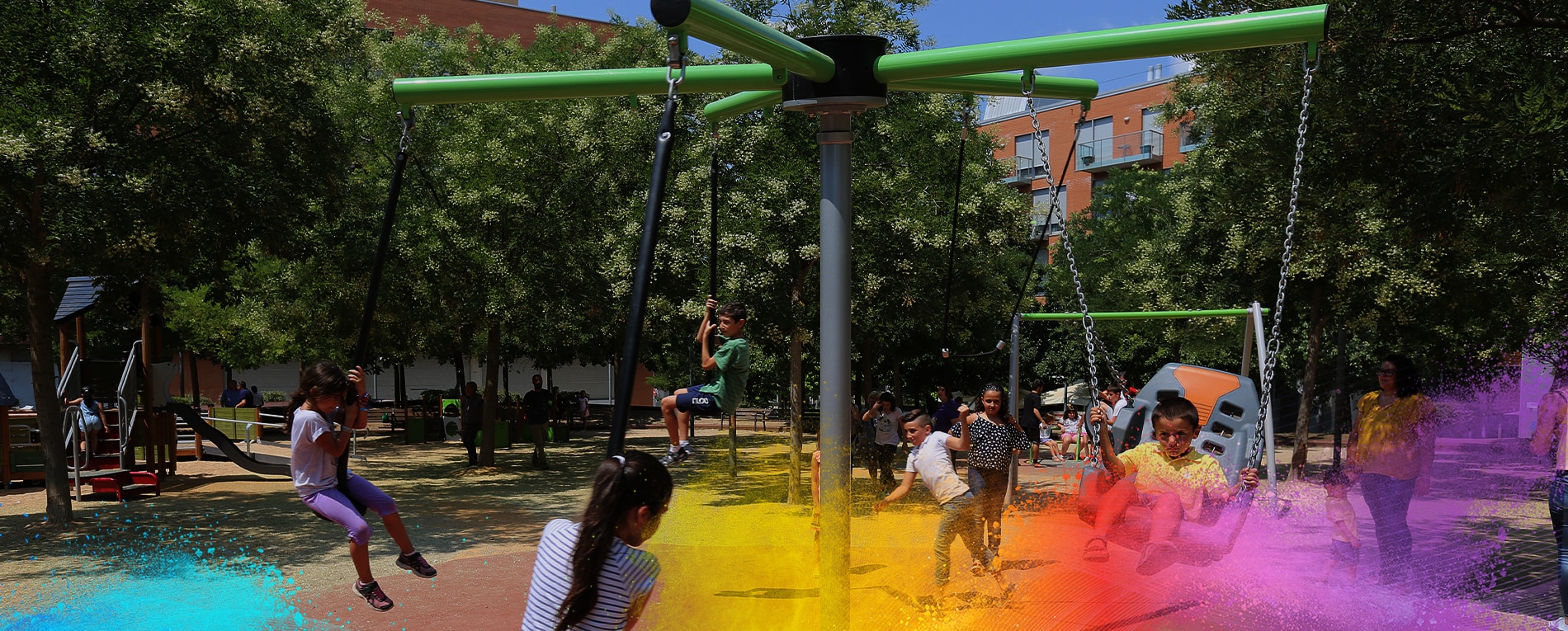 Children playing on a swing and zip line structure in an outdoor playground.