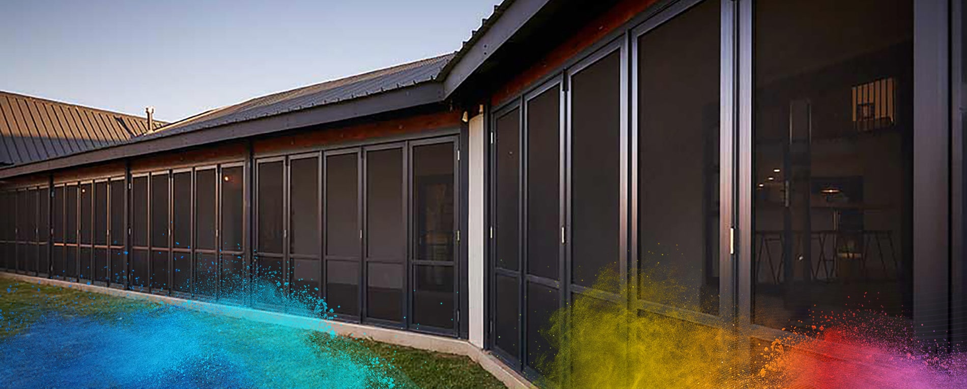 Row of security screen doors and windows on a modern building exterior.