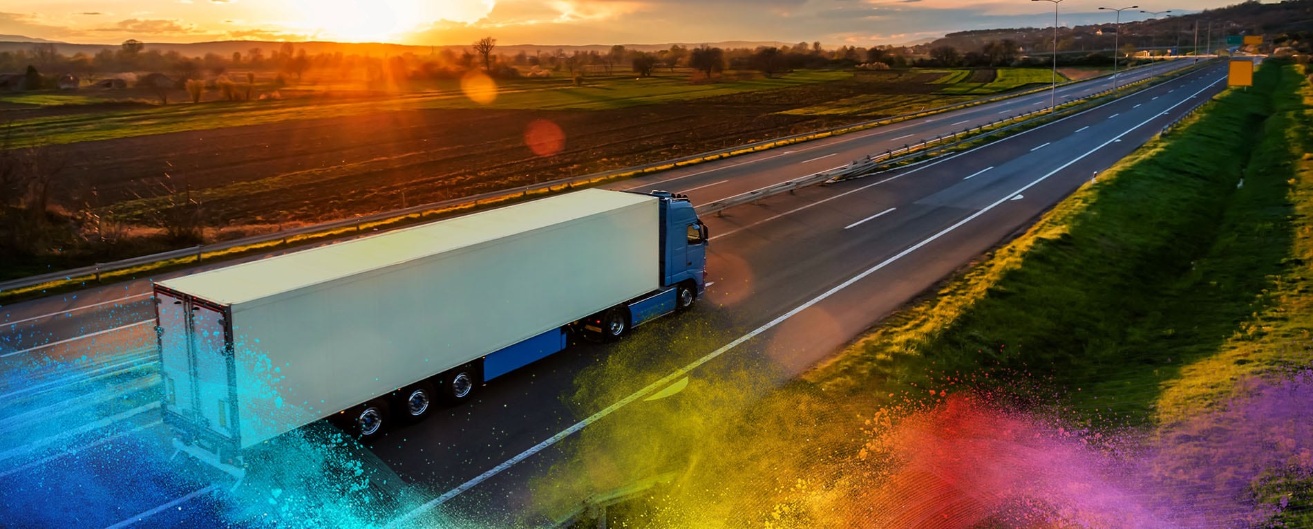 A white truck trailer on the highway
