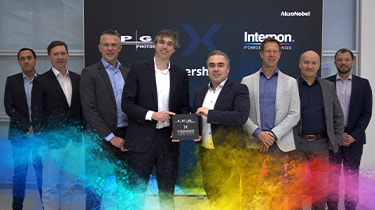 Group photo of Interpon and IPG Photonics teams celebrating new partnership