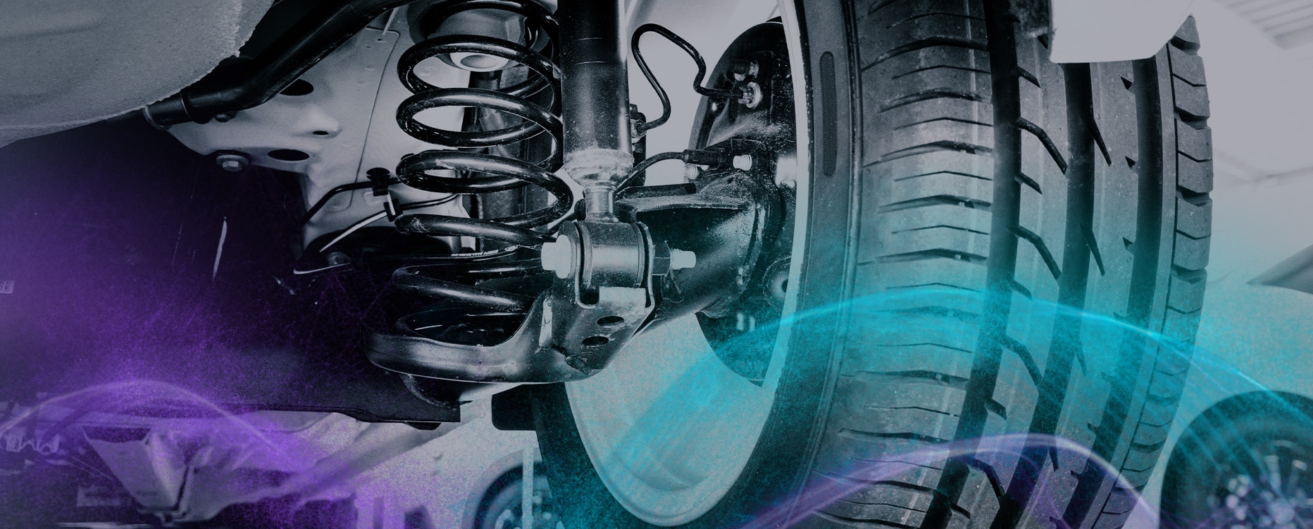 A car's underbody showing the suspension system, springs, and wheel, highlighting parts