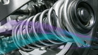 Car suspension spring and wheel assembly.