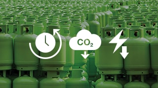 Rows of green gas cylinders in storage