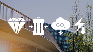 Person cycling on a modern elevated bridge near a glass office building