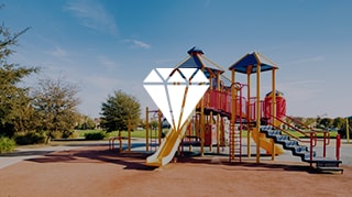 Colorful playground structure with slides and climbing equipment in an outdoor park