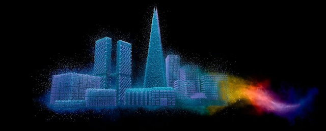 Powder-coated cityscape with colorful powder cloud on dark background
