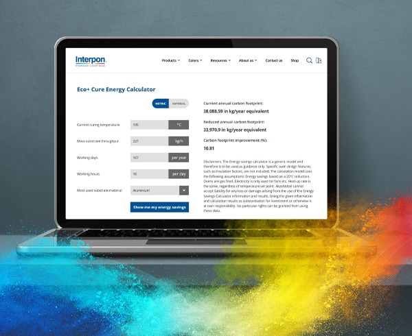 Laptop with Interpon Eco+ Cure Calculator page and colored powder around.