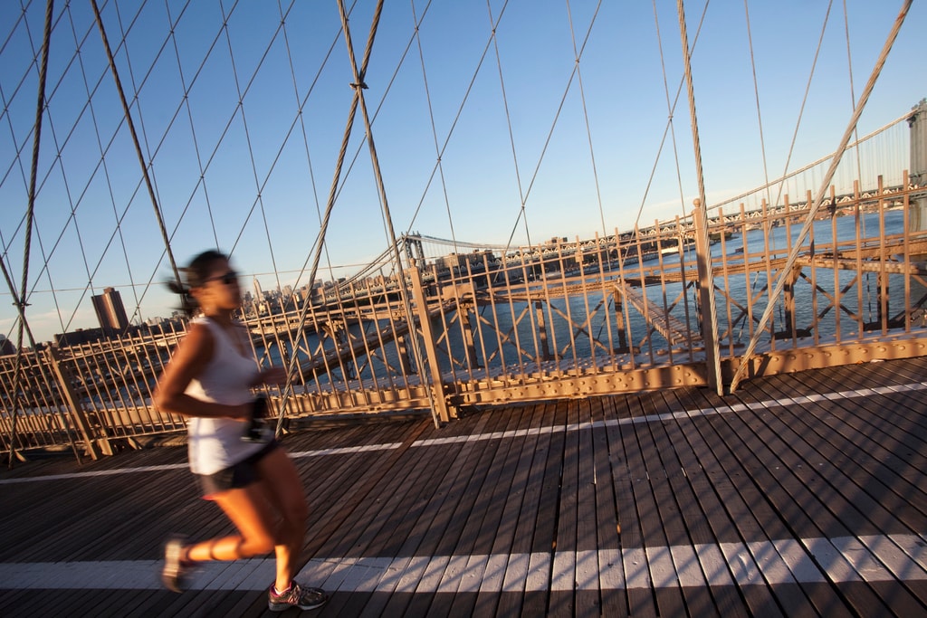 Woman running on the Brooklyn Bridge