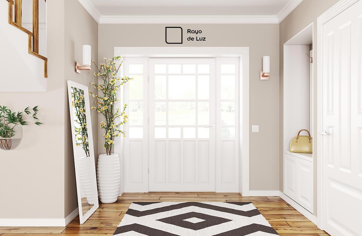 Recibidor decorado con el color Rayo de Luz. Este tono neutro aportó más luz al ambiente.