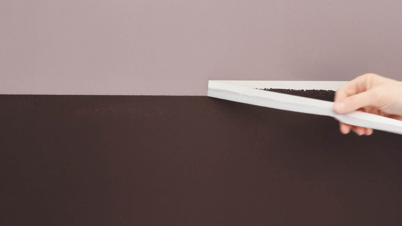 Remove the masking tape to unveil your completed two-tone wall