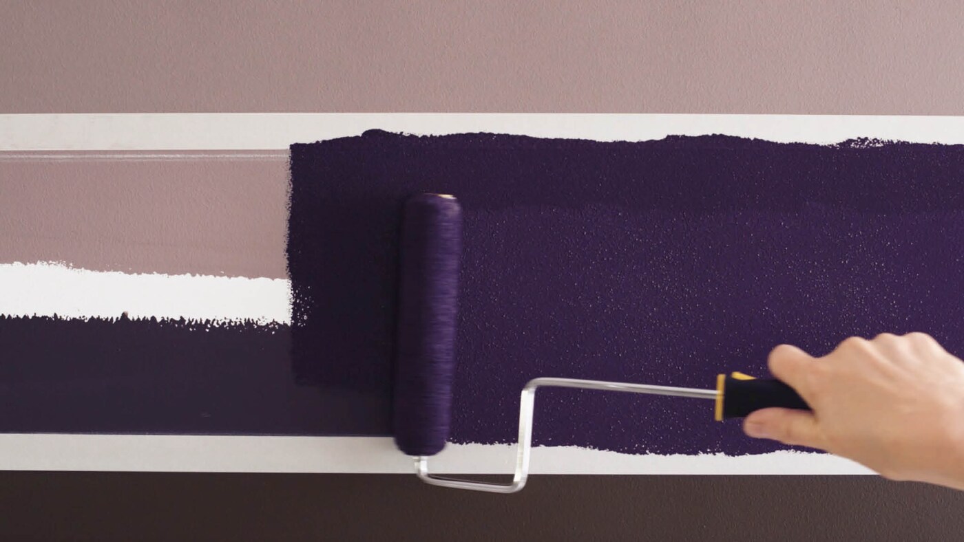 Paint between your taped lines with a small roller