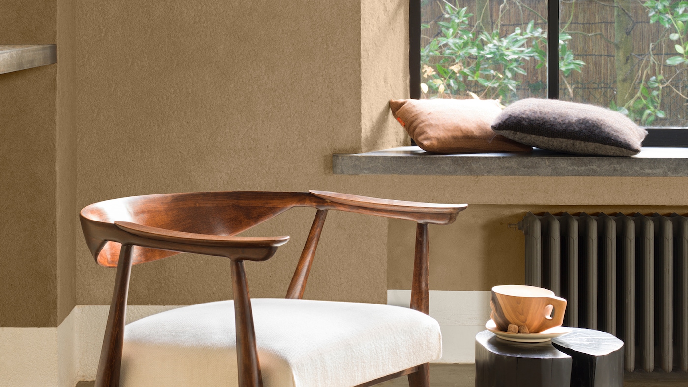 Adding sand to paint is an easy and affordable way to give your walls a nature-inspired rough feel.