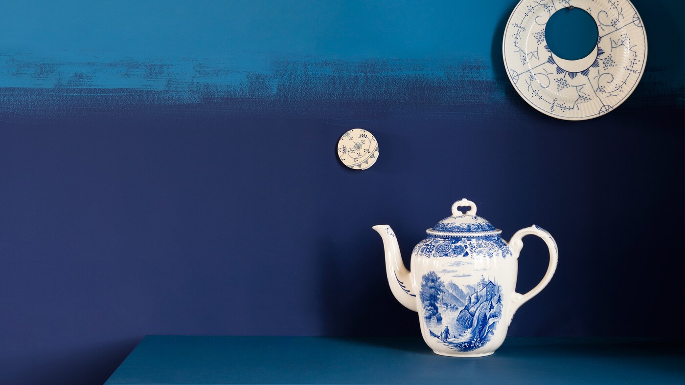 Try a bold statement wall with different shades of one colour in rough, dramatic lines.