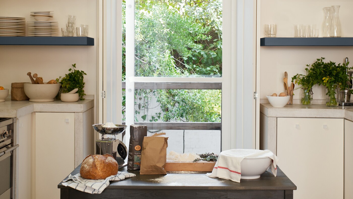 A coat of paint will instantly revive old kitchen cabinets.