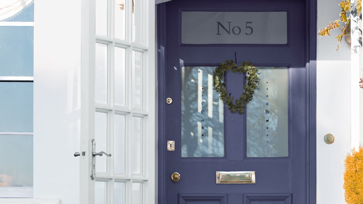 Painted wooden front door brightens the entrance to your home