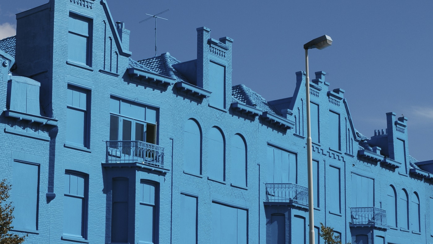 Row of striking blue houses in Rotterdam.