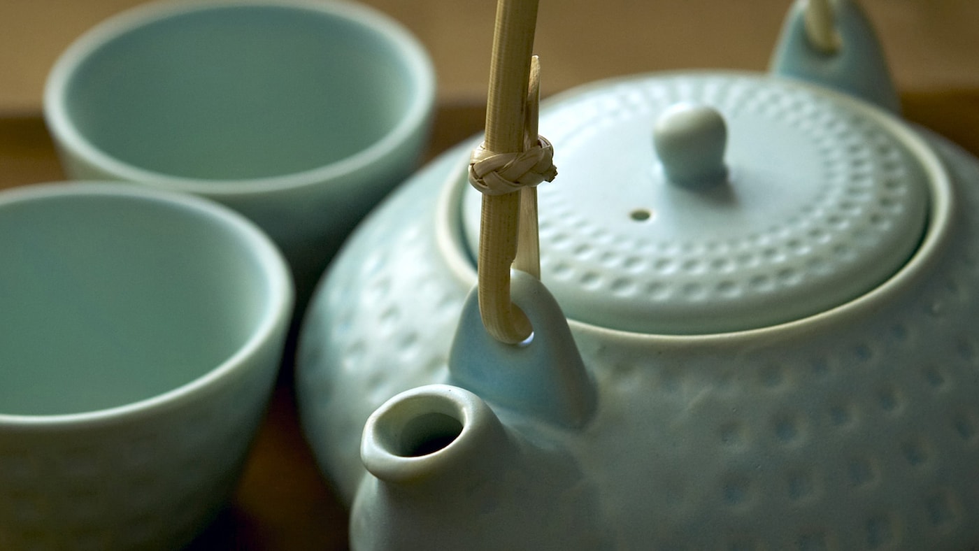 Asian-style teapot made from delicate celadon-coloured porcelain. 