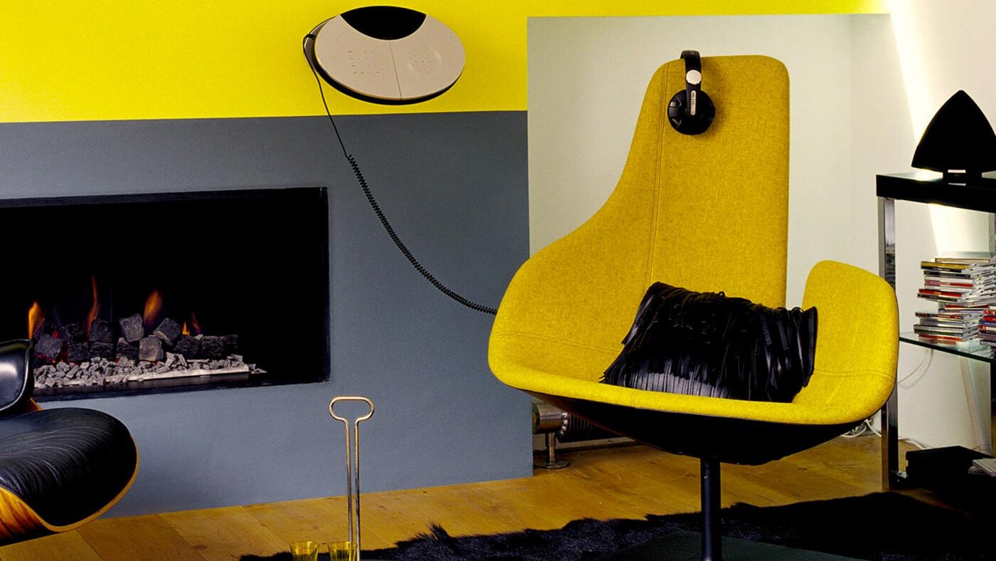 Sophisticated grey living room mixed with bright yellow pops of colour.