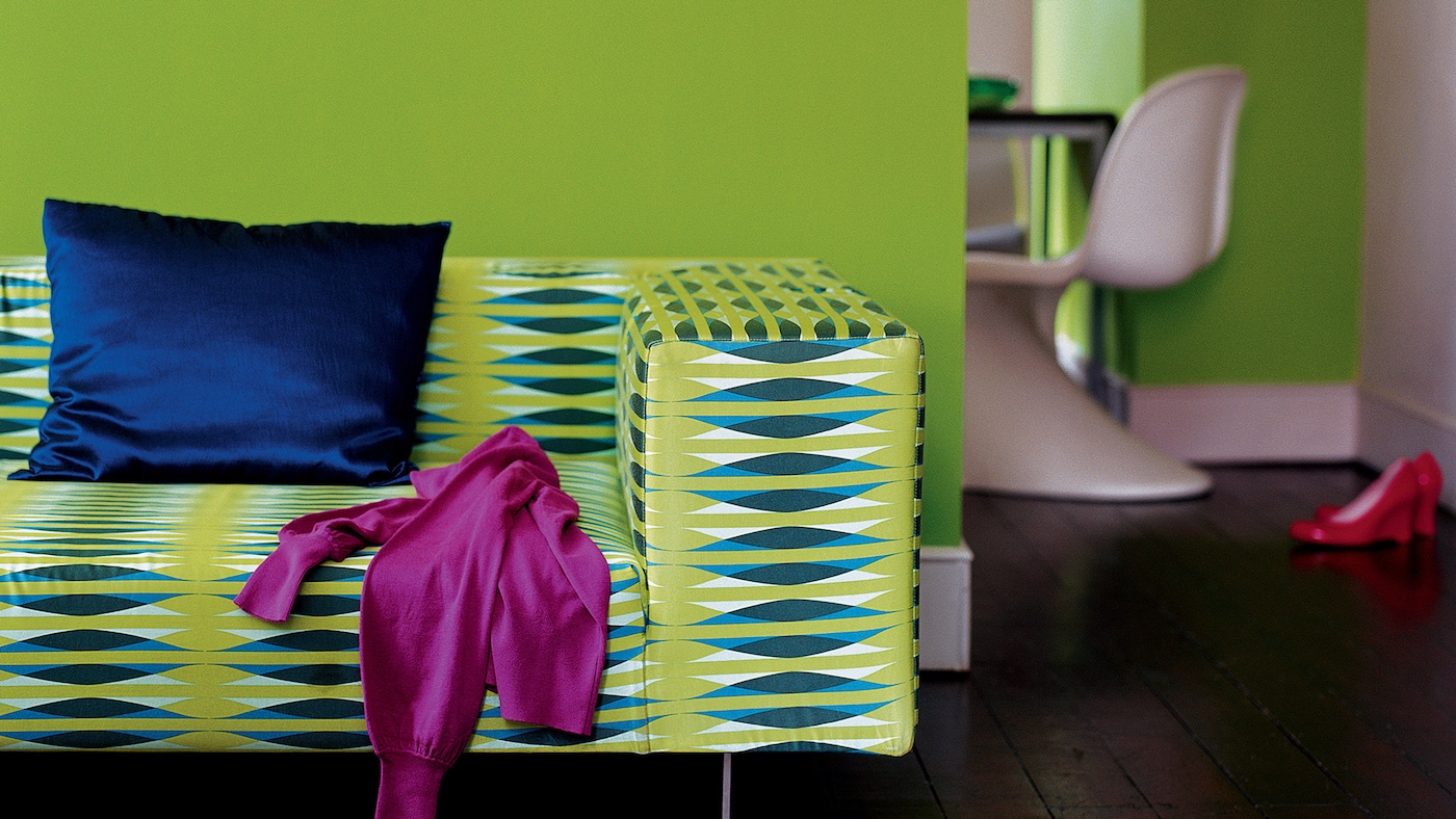 Living room decorated in lively shades of lime, electric blue and fuchsia.