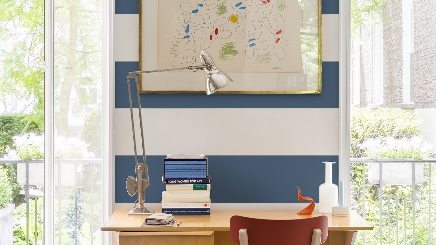 Learn how to create a nautical-themed study area by painting a feature wall of bold blue and white stripes. 
