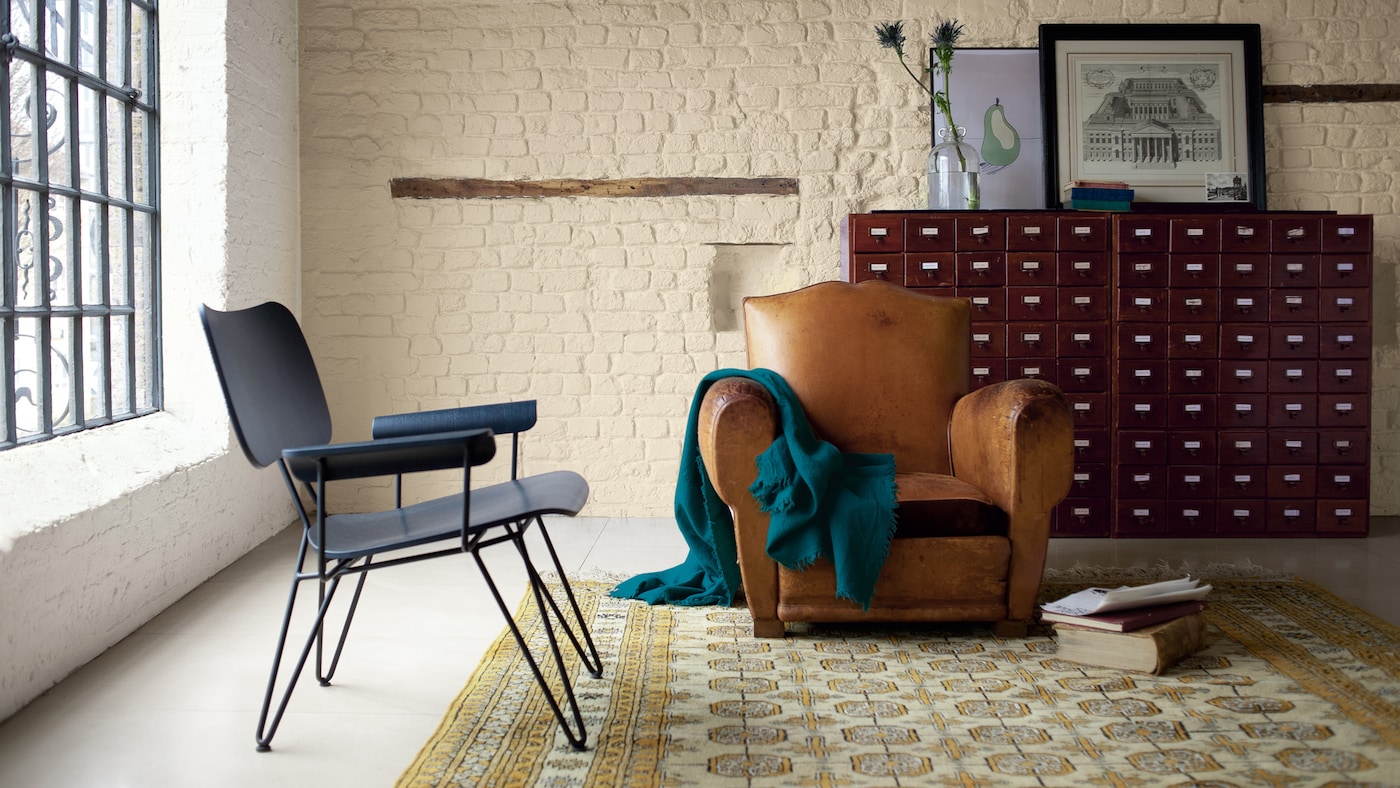 Use warm cream paint on brick to create a soft, simple look.