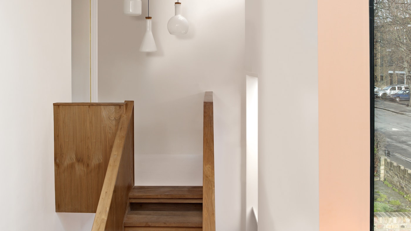 Add width to a tall, narrow space with a dark ceiling.