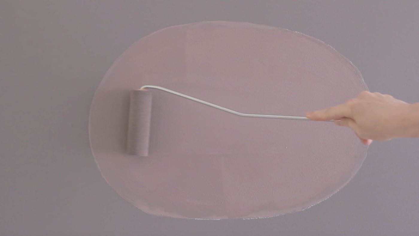 Paint your oval with a small roller and paint brush