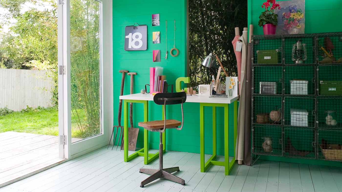Punchy emerald green contrasts with vintage office furniture.
