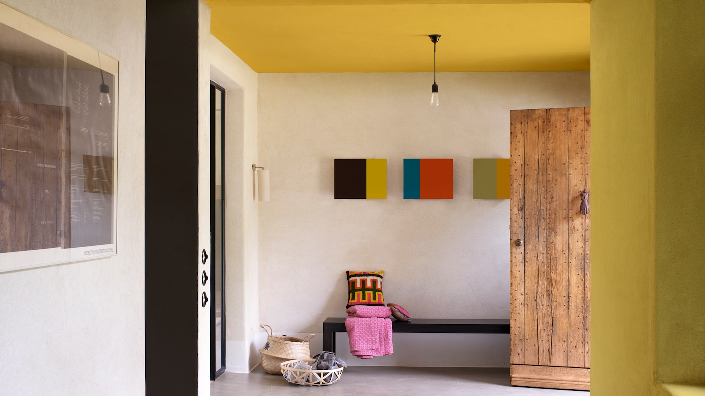 Use a mustard shade on a hallway ceiling to brighten the space.
