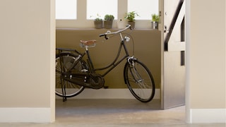 Warm neutrals and olive give this entrance hall an inviting mood.