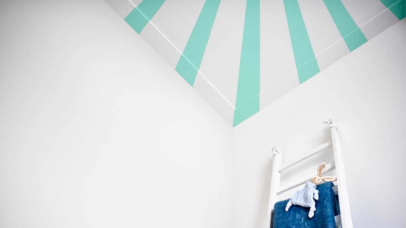 Babies are fascinated by high-contrast patterns, which makes stripes the perfect choice for a nursery room ceiling.