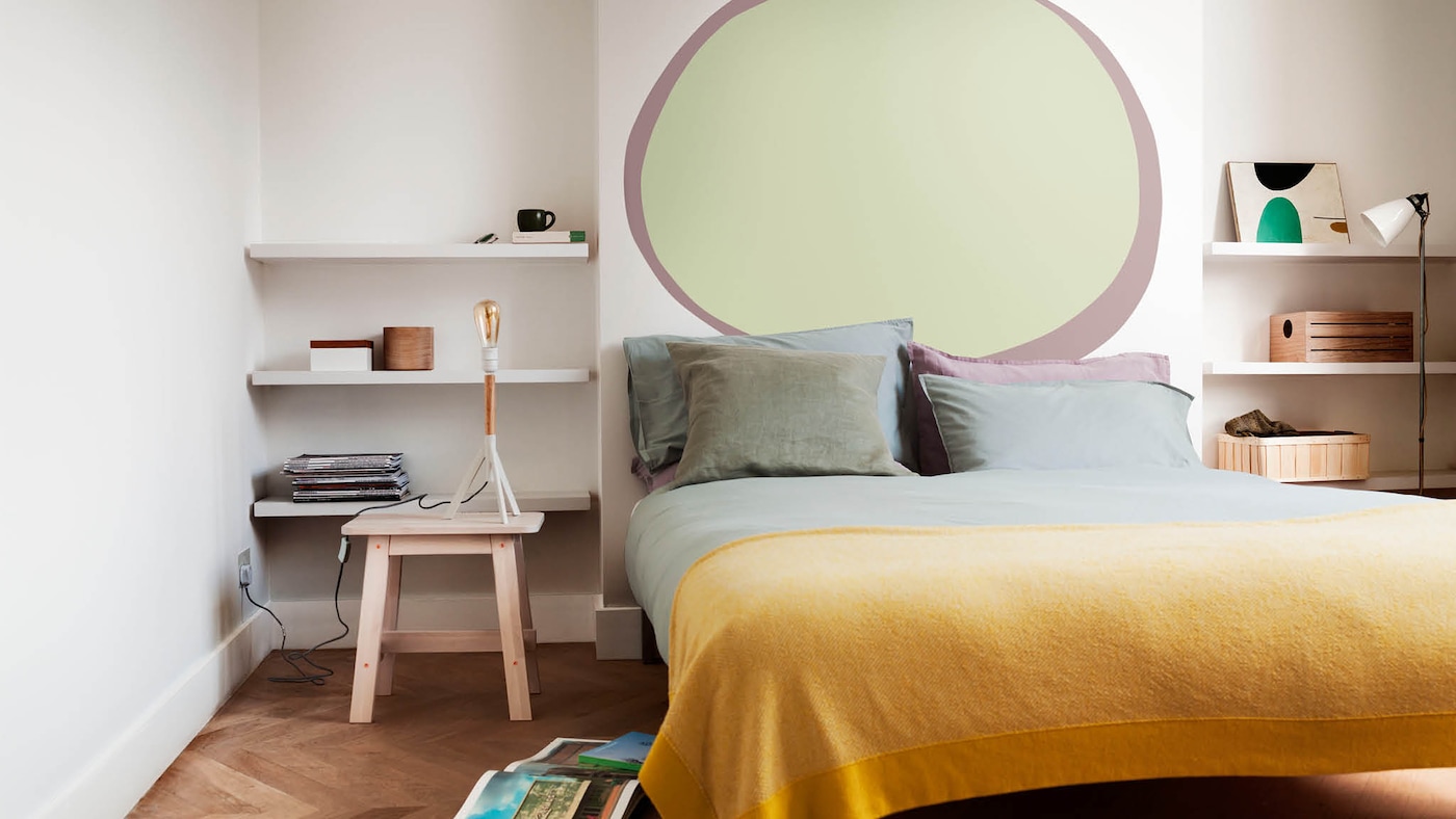 Bedroom with a painted oval on the wall